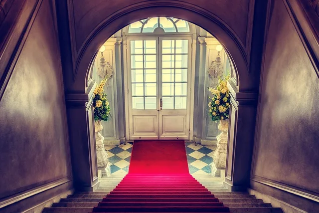 staircase, foyer, residence, stairs, red carpet, luxury, architecture, indoors, staircase, stairs, red carpet, red carpet, red carpet, luxury, luxury, luxury, luxury, luxury. Rented or borrowed award-show looks: the care the law expects