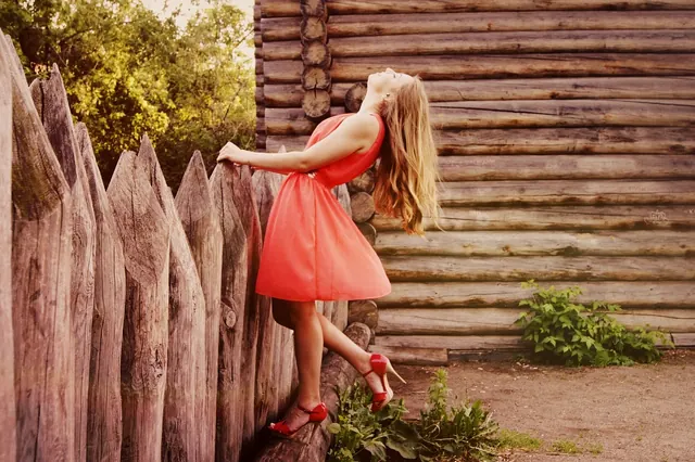 girl, dress, fence, wooden fence, fashion, style, heels, long hair, feminine, young woman, woman, female, red dress, hairstyle, hair, freedom, model, femininity, dress, dress, dres. How to Read a Red Carpet Dress Code Without Asking the Host