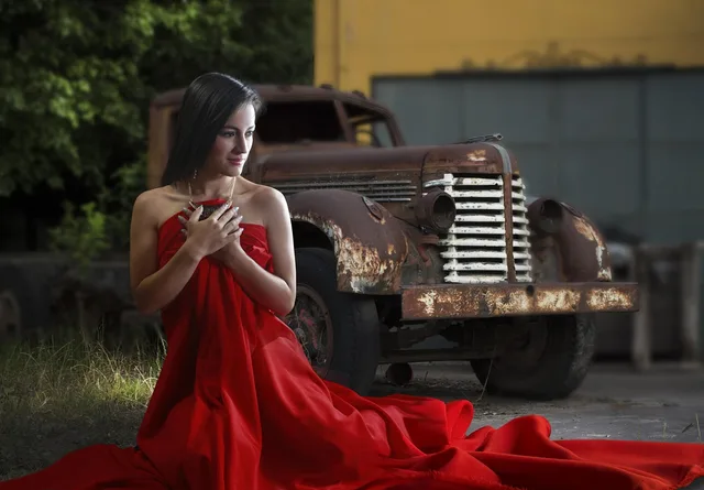 woman and car, red cloth, red dress, classic auto, old car, red cloth, red dress, red dress, red dress, red dress, red dress. Do Red Carpet Dresses Get Resold? Tracking the Secondary Market